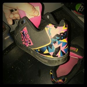 An old pair of woman DC multi-colored size 8-1/2